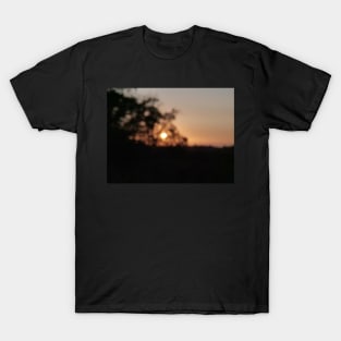 Sunset or sundown in out of focus T-Shirt